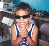 A Boy in Belize Is Excited To Receive Sunglasses